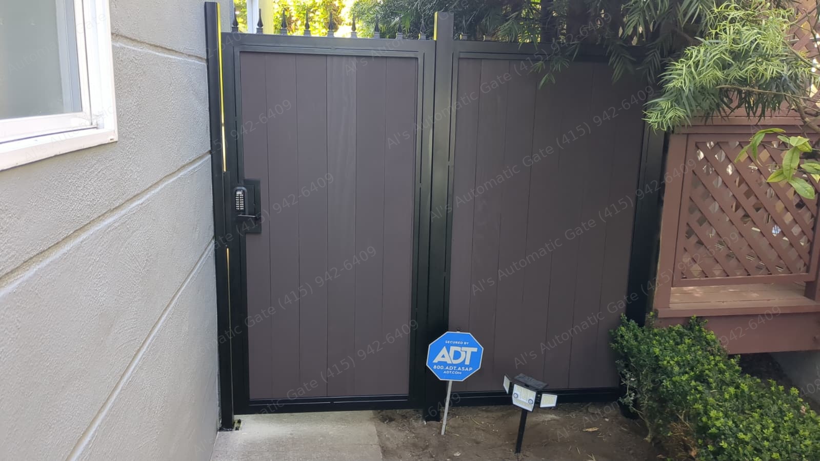 Double walk gate with keypad lock and decorative spear tops