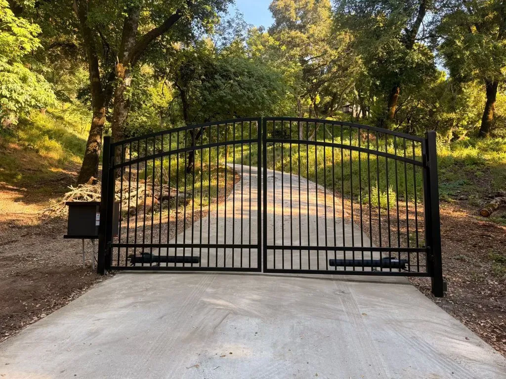 Ornamental iron driveway gate installation in San Rafael CA