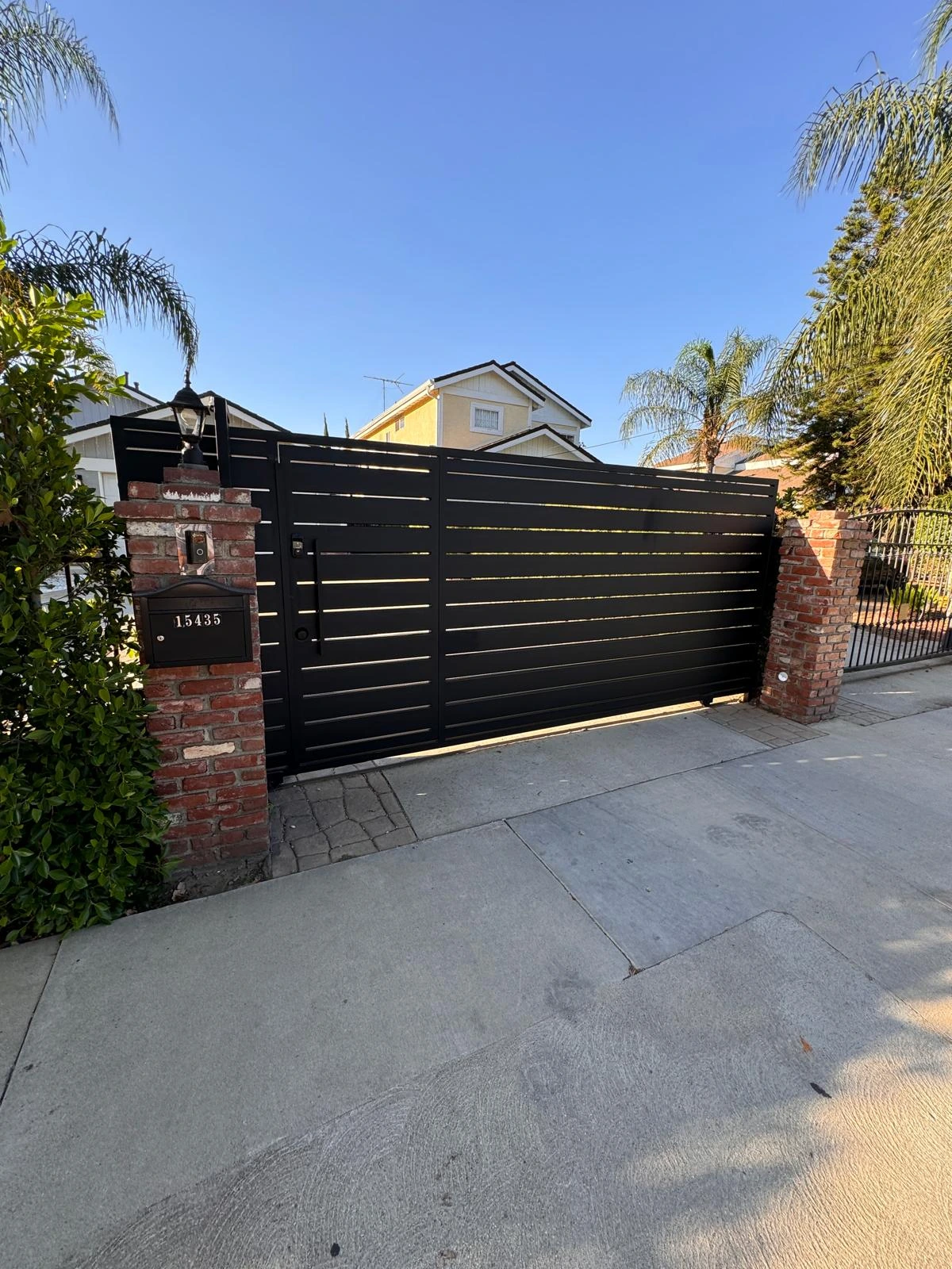 Black steel automatic gate in San Rafael